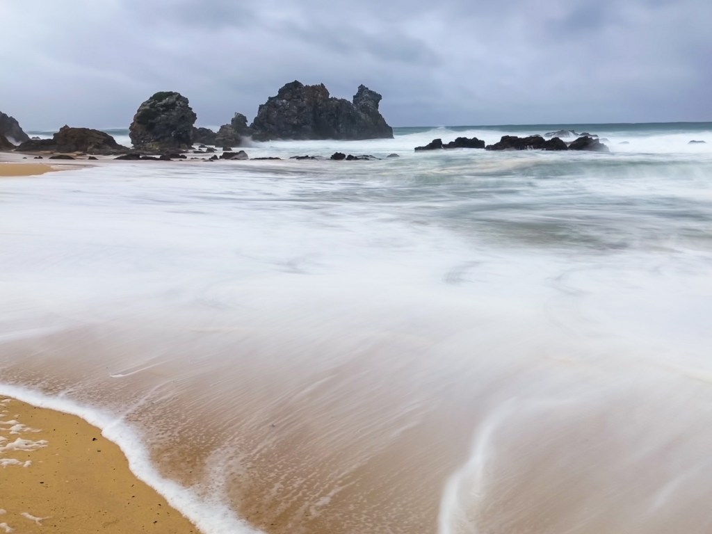 Wispy wave action from a long exposure iPhone shot of the ocean