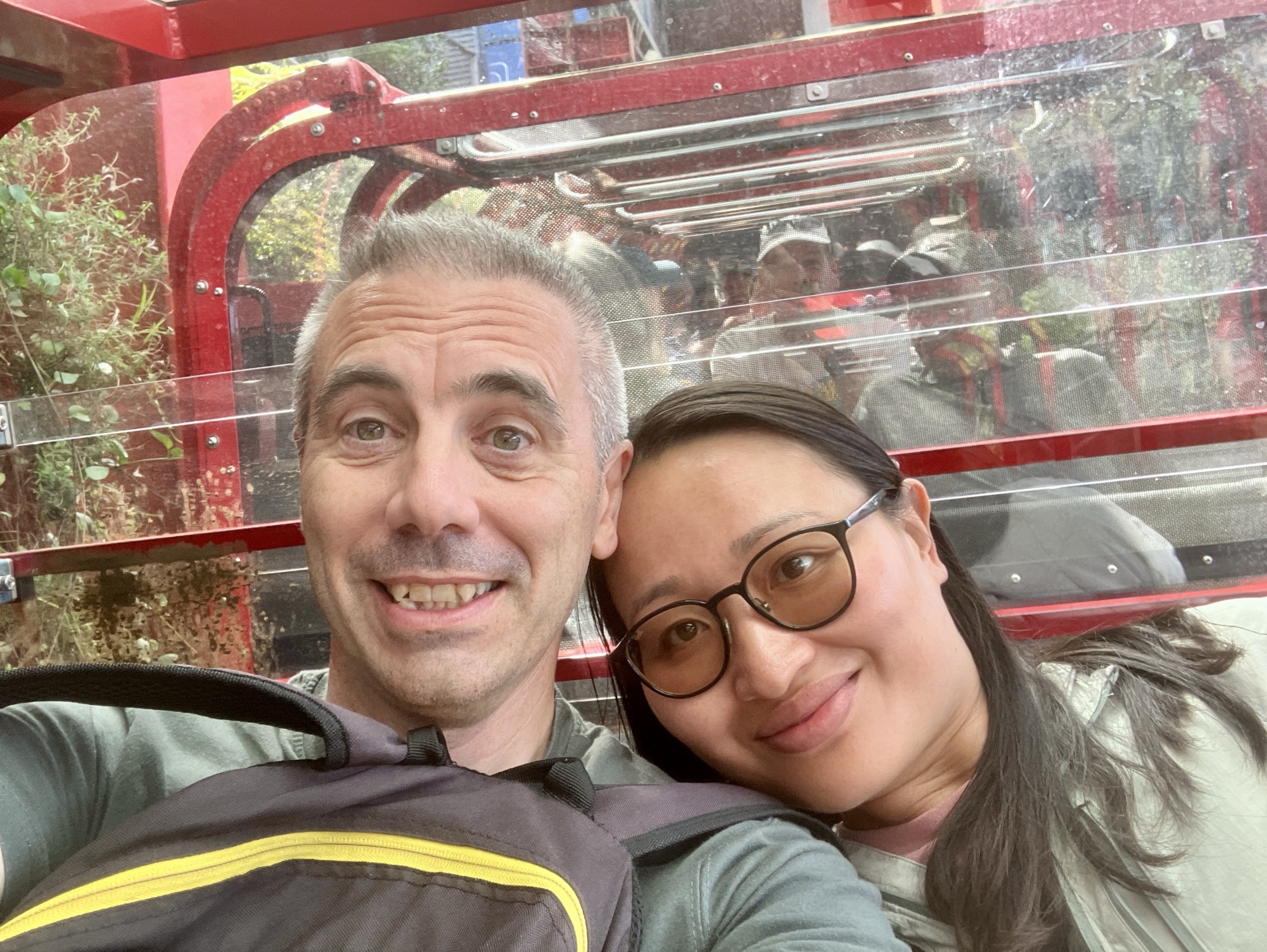 Two people on a cog railway carriage 