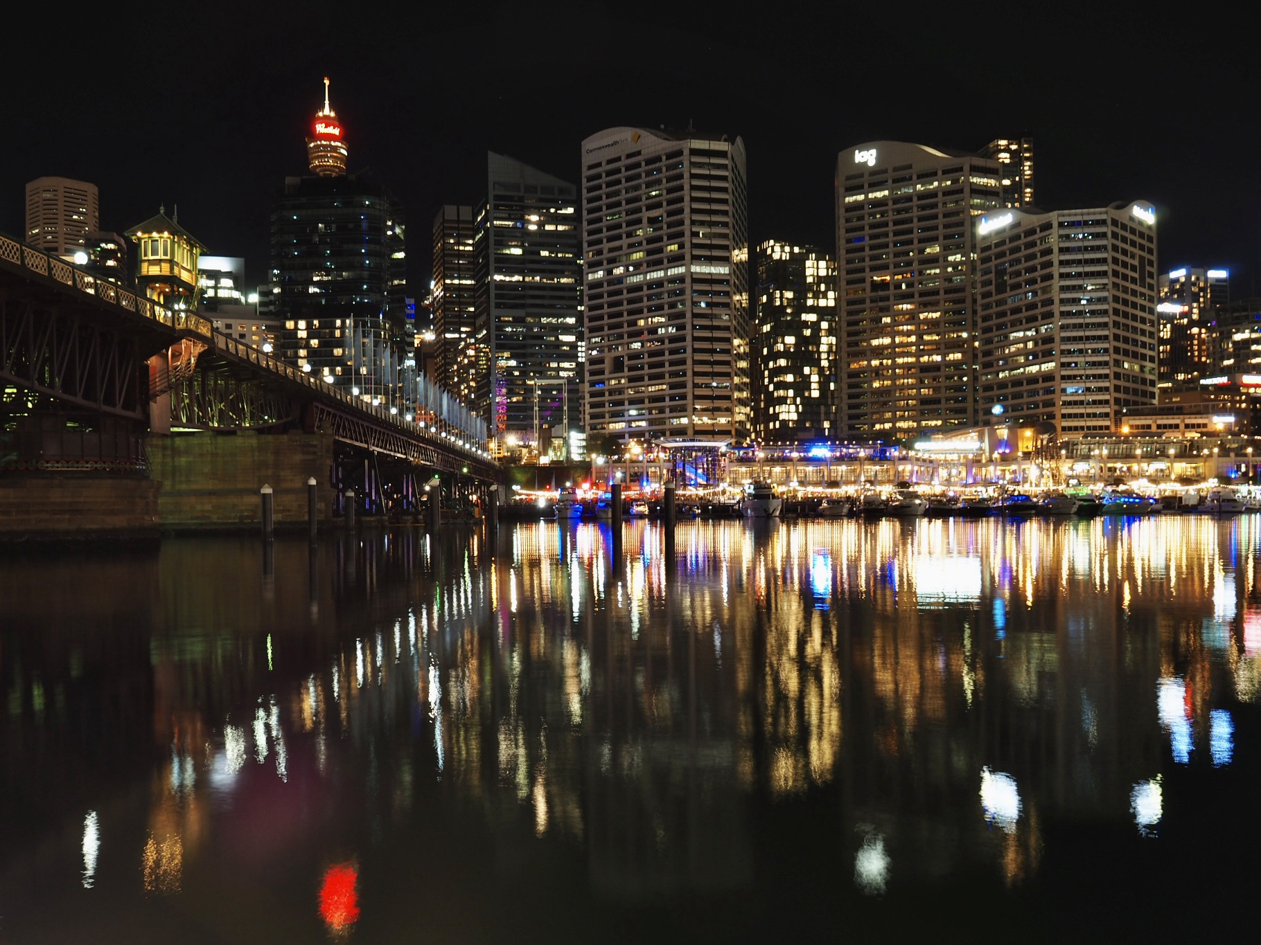 Sydney cityscape at night reflected in water